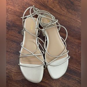 Never worn express tie up sandals in rose gold, size 7